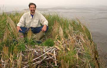 Dr. P on eagle nest on top of rock.
