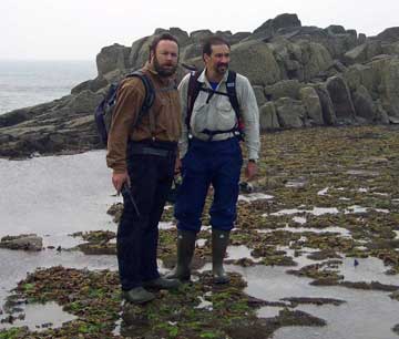 Dr. P standing with guide in mud flats.