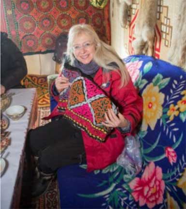 Dr. K holding a present