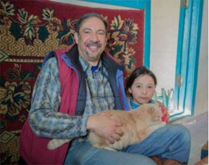 Dr. P with young girl and her cat