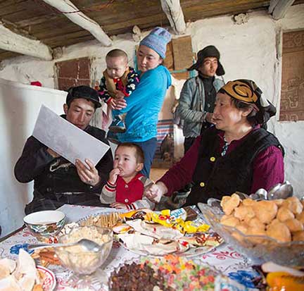 Family looking at pictures of themselves