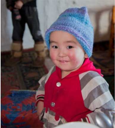 Smiling boy wearing knit hat