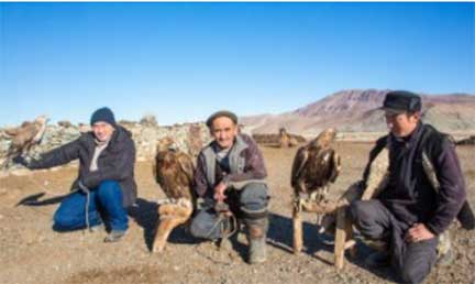 Three men with eagles
