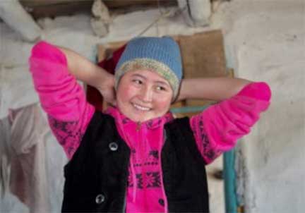 Smiling girl modeling knit hat