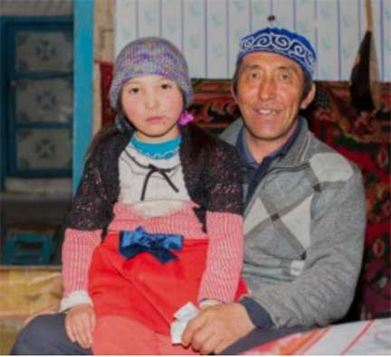 Nomad with daughter on his lap