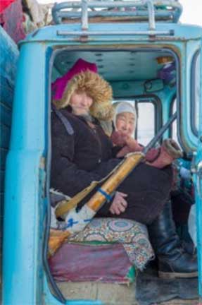 Grandpa and grandma riding shotgun in the truck