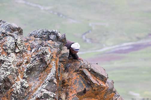 Our nomad guide climbing to get a better view of the nest