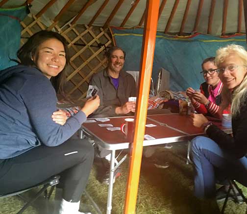 Playing cards around a table in the Ger