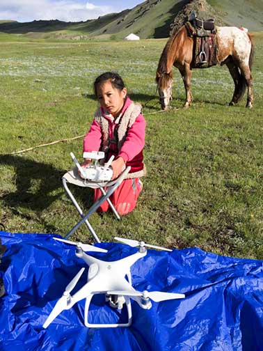 Our young camera lady readying the drone for filming