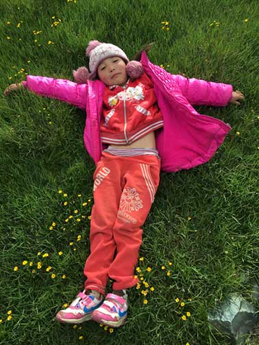 Our drone pilot practicing her snow angels