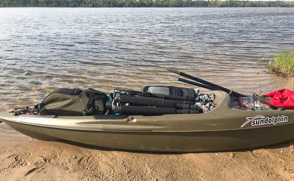 Kayak loaded with photography equipment