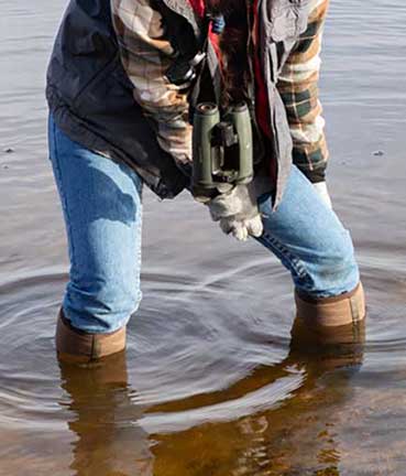 Boots sinking into muck