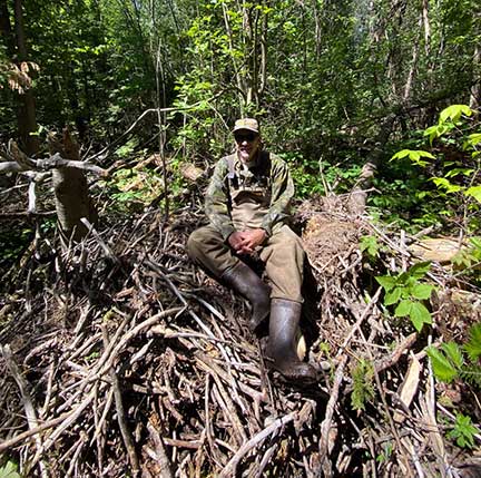 Fallen eagle nest with Dr. P sitting on it