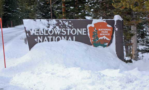Yellowstone entrance sign covers in snow