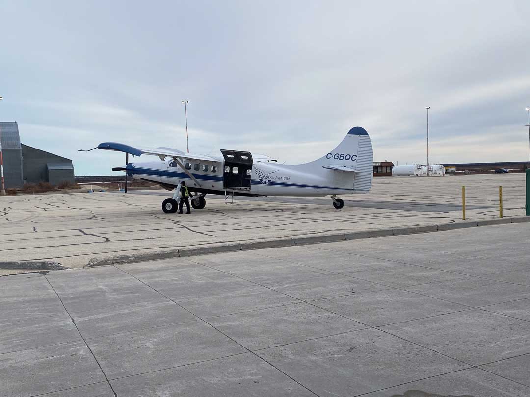 Bush plane on tarmac.