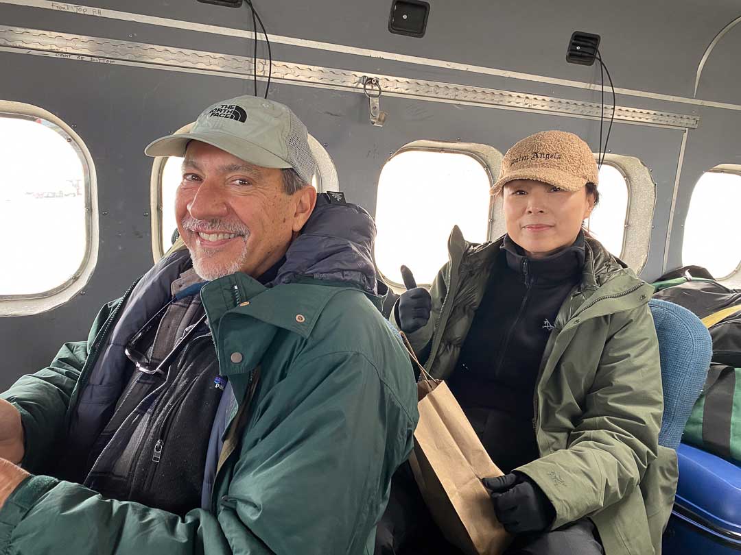 Dr. P with fellow passenger on the bush plane.