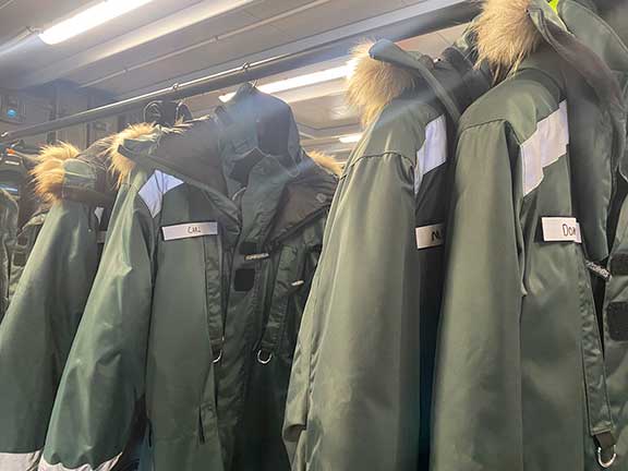 One piece polar suits hanging. 