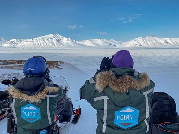 Polar bear snowmobile trip scanning for bears. 