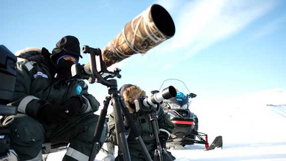 Dr. P using camera and telephoto lens