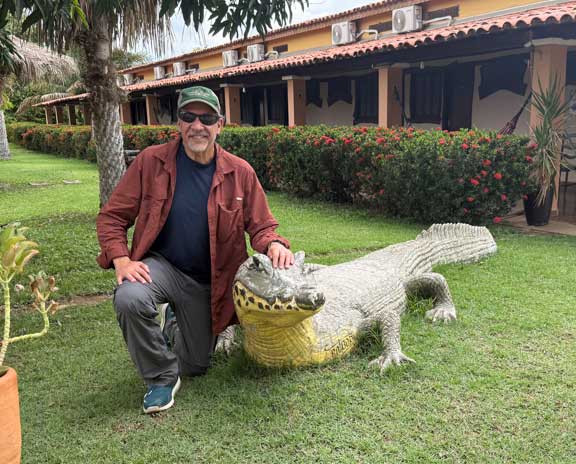 Dr. P with a Caiman statue. 