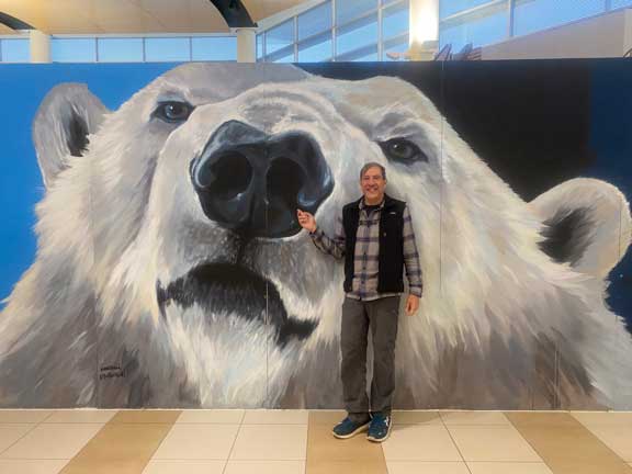 Polar bear mural on wall of airport.