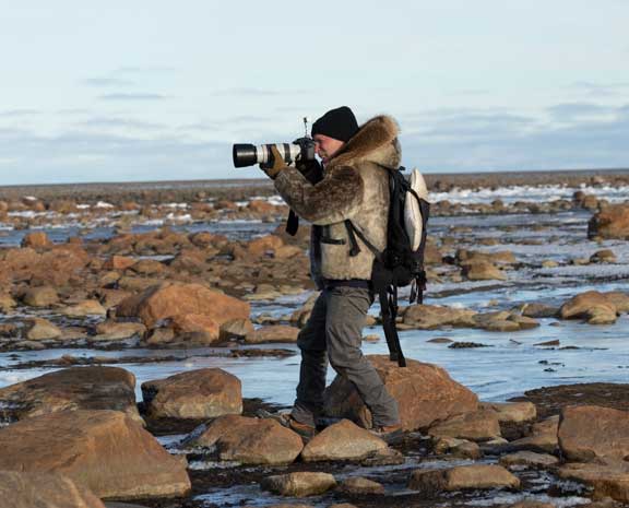 Guide taking photo of bear
