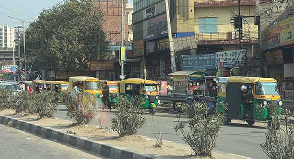 Rickshaws waiting at the curb