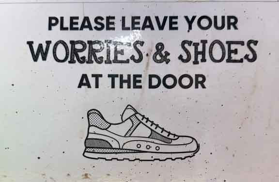 Leave your worries and shoes at the door sign