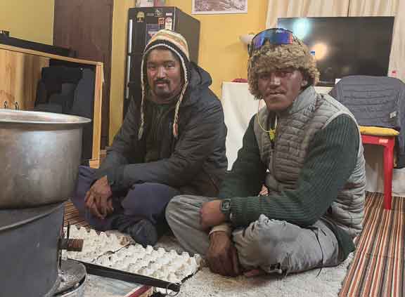 The spotters warming up around the stove